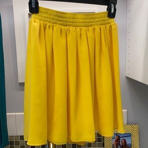 Yellow American Apparel yellow mini skirt.